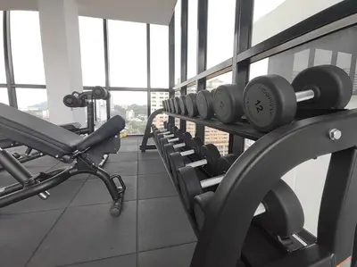 a gym with a row of dumbbells on a rack at Seaview Infinity Pool , 40th , 9pax, 3Rooms 2Carpark in Jelutong