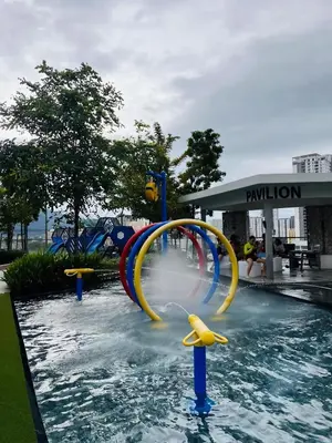 a water park with a water slide in the water at Urban Suites Georgetown l SeaView & CityView l Family Stay in Jelutong