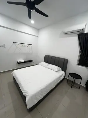 a bedroom with a bed with a ceiling fan at Sense In Passionate in Sitiawan