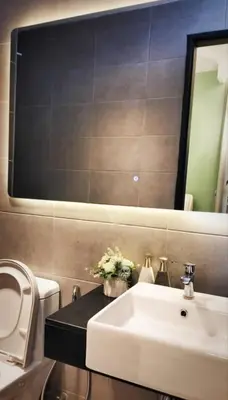 a bathroom with a white sink and a mirror at 
