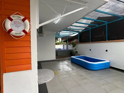 a room with a life preserver on the side of a building at Agro Village Stay in Tapah