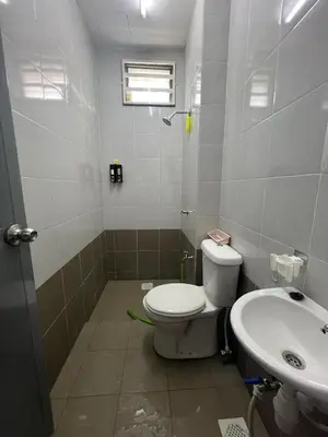 a bathroom with a toilet and a sink at Teratak Amaris Homestay MELAYU ONLY in Sungai Petani