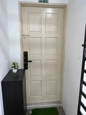 a white door with a sign on top of it at Pusing Kampung Affordable Homestay Astro in Pusing