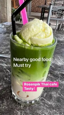 a drink with a spoon in a green drink at Pusing Kampung Affordable Homestay Astro in Pusing