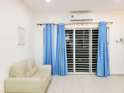 a living room with a chair and a window with blue curtains at IPOH BOTANI bauhaus 17pax/4BR/mahjong/tv box in Ipoh