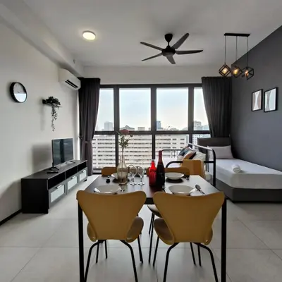 a dining room and living room with a table and chairs at New Urban Suite Majestics 3BR Homestay at Georgetown BY URBAN STAYCATION LOD PULSE in Jelutong