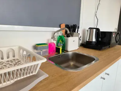 a kitchen counter with a sink and a microwave at New Urban Suite Majestics 3BR Homestay at Georgetown BY URBAN STAYCATION LOD PULSE in Jelutong