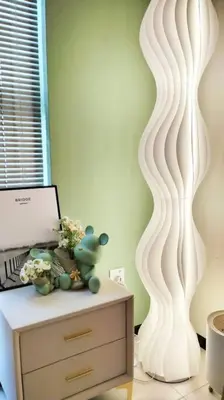 a room with a table with a laptop and a white wall at Romantic Sea View @ Urban Suite in Jelutong