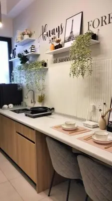 a kitchen with a counter with plates on it at Romantic Sea View @ Urban Suite in Jelutong
