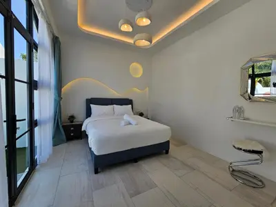 a bedroom with a bed in a room at Ipoh Young Villa - Hotel Inspired in Ipoh