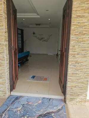 a hallway with a door open to a room at Cozy Roomstay Padang Serai in Padang Serai