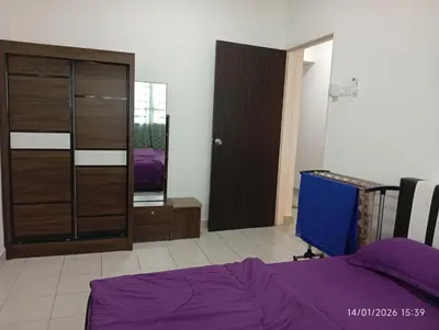 a bedroom with a bed and a dresser and a closet at Seberang Jaya Family Pool Homestay Near Hospital 3 Bedroom Aircond 2 Bathroom & Family Room Aircond in Perai