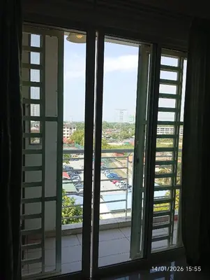 a window with a view of a parking lot at Seberang Jaya Family Pool Homestay Near Hospital 3 Bedroom Aircond 2 Bathroom & Family Room Aircond in Perai