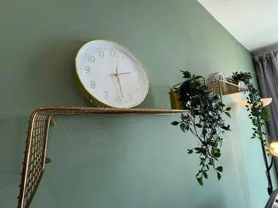 a clock on the wall next to a mirror at 【NEW】Harmony’s Home@Juru Sentral Icon City in Bukit Mertajam