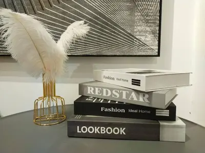 a stack of books with a white bird on top at be.Paradise Duplex@The Cove-8mins to LWOT-12-14pax in Ipoh