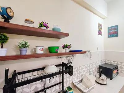a kitchen with a counter with shelves and plants at Pavilionvillie M1T692 by irainbow in Ipoh