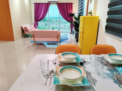 a dining room with a table with plates and glasses at Pavilionvillie M1T692 by irainbow in Ipoh