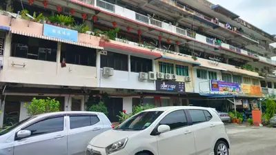 two white cars parked in front of a building at Kitty Home Near to Penang Hill in Ayer Itam