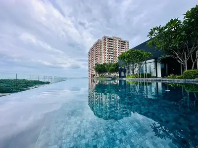 a large pool of water with a building in the background at Apartment in Georgetown 3BR-10pax in Jelutong