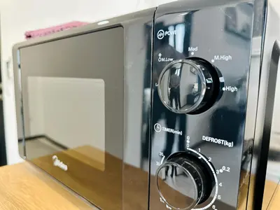 a close up of a toaster oven on a table at Apartment in Georgetown 3BR-10pax in Jelutong