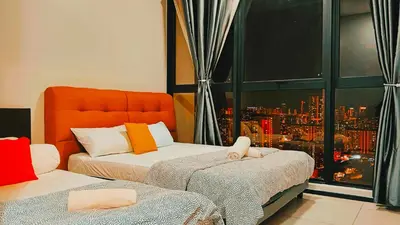 a bedroom with two beds with a view of a city at Apartment in Georgetown 3BR-10pax in Jelutong