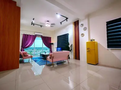 a living room with pink chairs and a yellow cabinet at Pavilionvillie M1T694 by irainbow in Ipoh