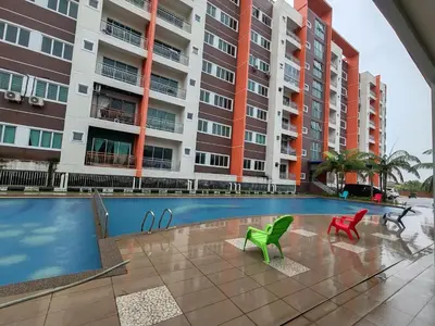 a swimming pool in front of a apartment building at Pavilionvillie M1T694 by irainbow in Ipoh