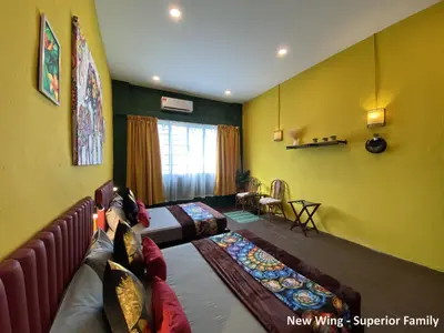 a living room with yellow walls and a couch at Rope Walk Guest House in George Town