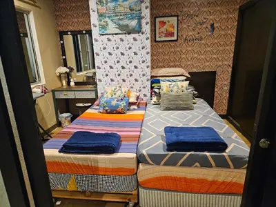 a bedroom with two twin beds in it at Tower Homestay @ Muslim Friendly in Ipoh