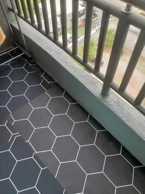 a balcony floor with a railing and a view of a street at Tower Homestay @ Muslim Friendly in Ipoh