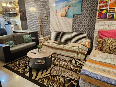 a living room with a couch and a table at Tower Homestay @ Muslim Friendly in Ipoh