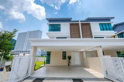 a white house with a gate in front of it at Solok Sungai Emas By Plush in Batu Ferringhi