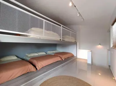 a bedroom with two beds on a shelf at Morning de Ville-Private Pool BBQ Karaoke 26-30pax in Ipoh