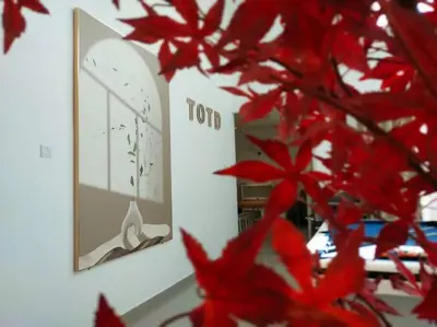 a picture of a clock on a wall with red leaves at Morning de Ville-Private Pool BBQ Karaoke 26-30pax in Ipoh