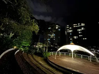 a train station at night with a white canopy at Ipoh Tambun Private Unit Lakeside Residences in Kampong Batu Lapan