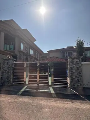 a wooden gate in front of a house at DOUBLE EE HOMESTAY 6 cars parking place 12pax in Sitiawan