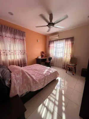 a bedroom with a bed and a ceiling fan at DOUBLE EE HOMESTAY 6 cars parking place 12pax in Sitiawan