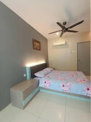 a bedroom with a bed and a ceiling fan at AYRA HOMESTAY in Kuala Kangsar