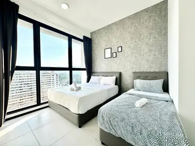 a bedroom with two beds and a large window at View of the whole Georgetown in George Town