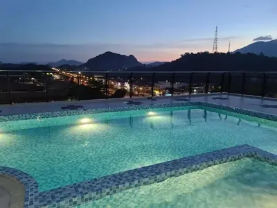 a large swimming pool on the roof of a building at RJ Studio 1 - Kompleks Mutiara in Gua Musang