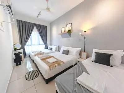 a bedroom with two beds and a window at Ipoh Horizon Skypool Town Suites 4-11pax by IWH Suites in Ipoh