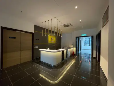 a bathroom with a tub and a sink at Corner Club Penang in George Town