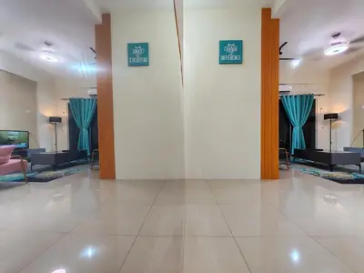 a lobby with blue signs on a white wall at Pavilionvillie M1T686 by irainbow in Ipoh
