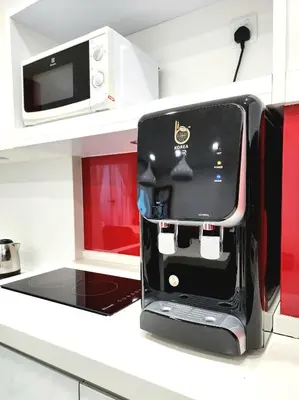 a kitchen with a microwave on a counter at Modern Suite in Penang Island in Jelutong