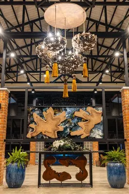 a room with a table with wooden star decorations at Sebayu Retreat Gopeng in Gopeng