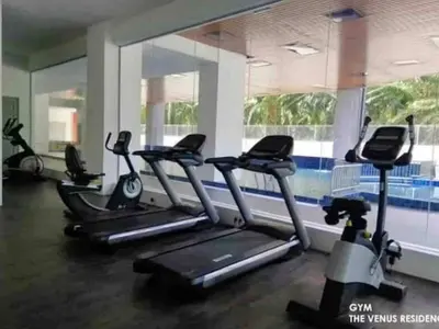a gym with treadmills and elliptical machines at The Ximplicity @ Venus Residence Sitiawan Manjung in Sitiawan