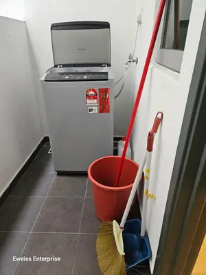 a room with a bucket and a broom and a dustbin at Metropol Serviced Apartment Bukit Mertajam Perda in Bukit Mertajam