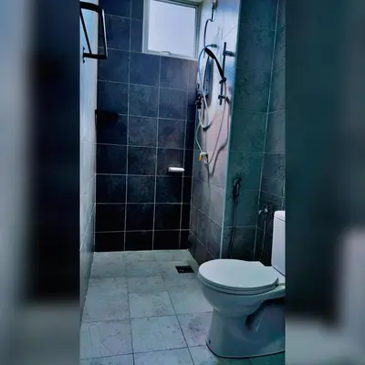 a bathroom with a toilet and a shower at Prima Falim in Ipoh