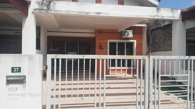 a house with a gate in front of it at FJ Homestay in Seri Iskandar