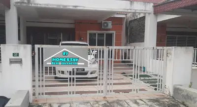 a white van parked in front of a house at FJ Homestay in Seri Iskandar